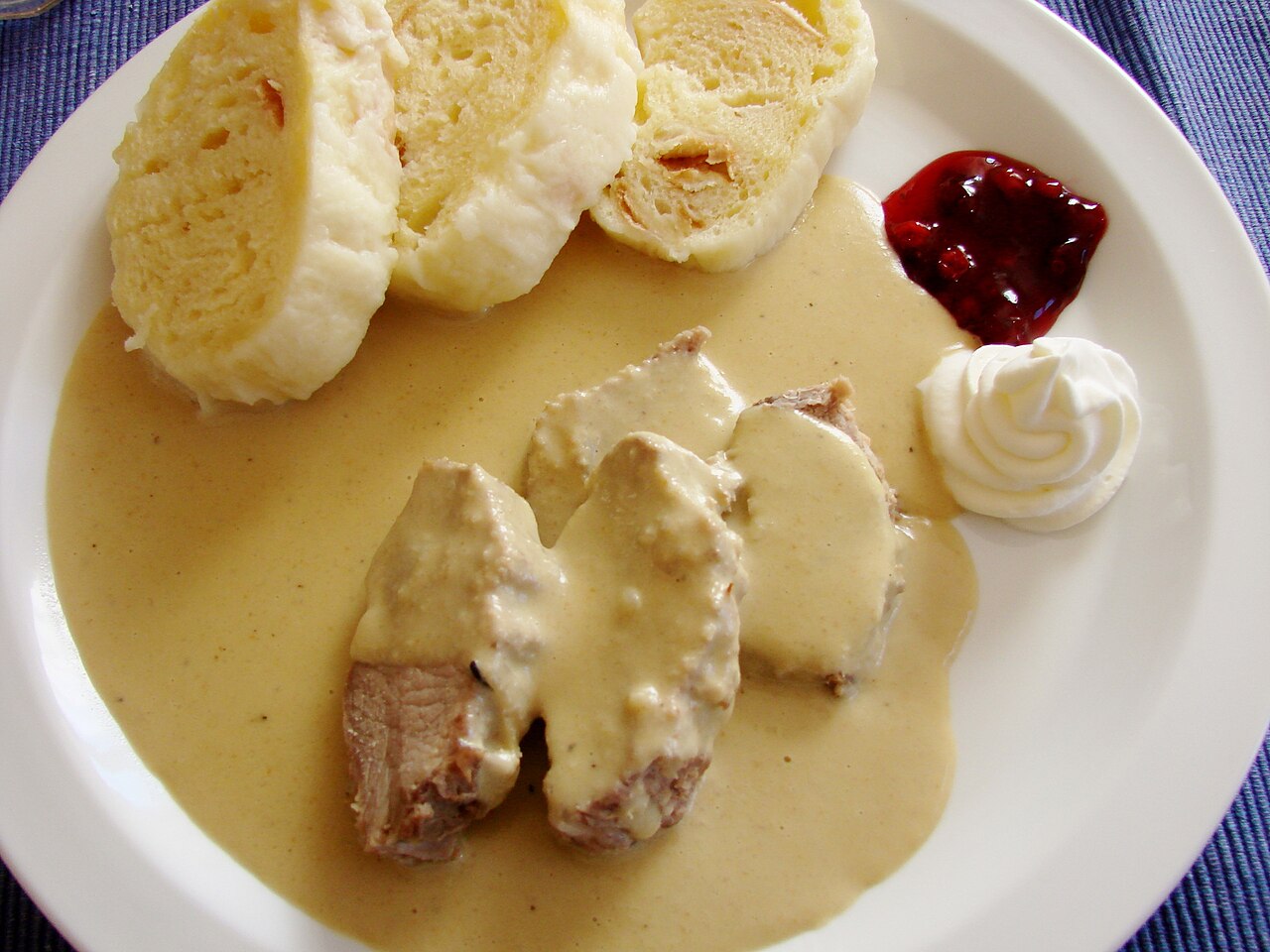 Svíčková na smetaně, a classic Czech beef dish with cream sauce and dumplings